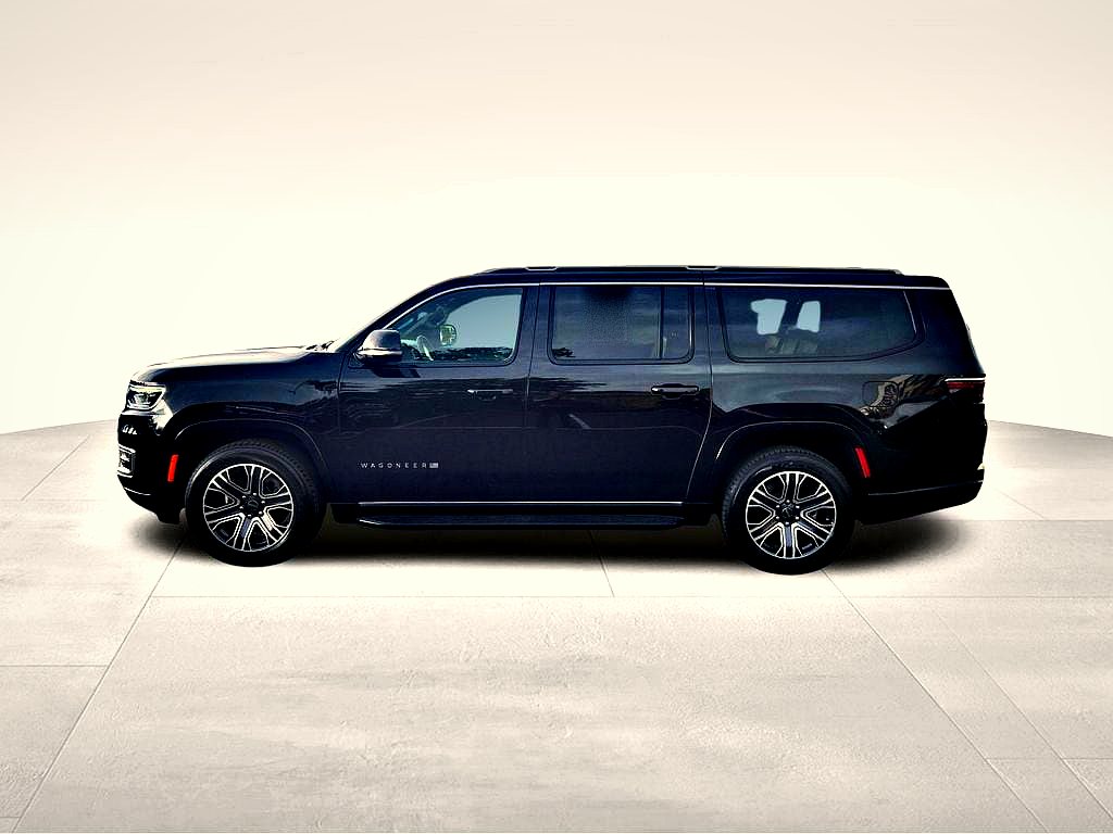 Black luxury SUV in profile, full vehicle